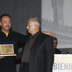 Prof. Pasquale Celona, President, and Piero Celona, Vice President of the Florence Biennale, awarded Antoine Gaber, Canadian, international impressionist artist painter, and cancer researcher with a recognition award for his humanitarian effort professed in the fight against cancer.